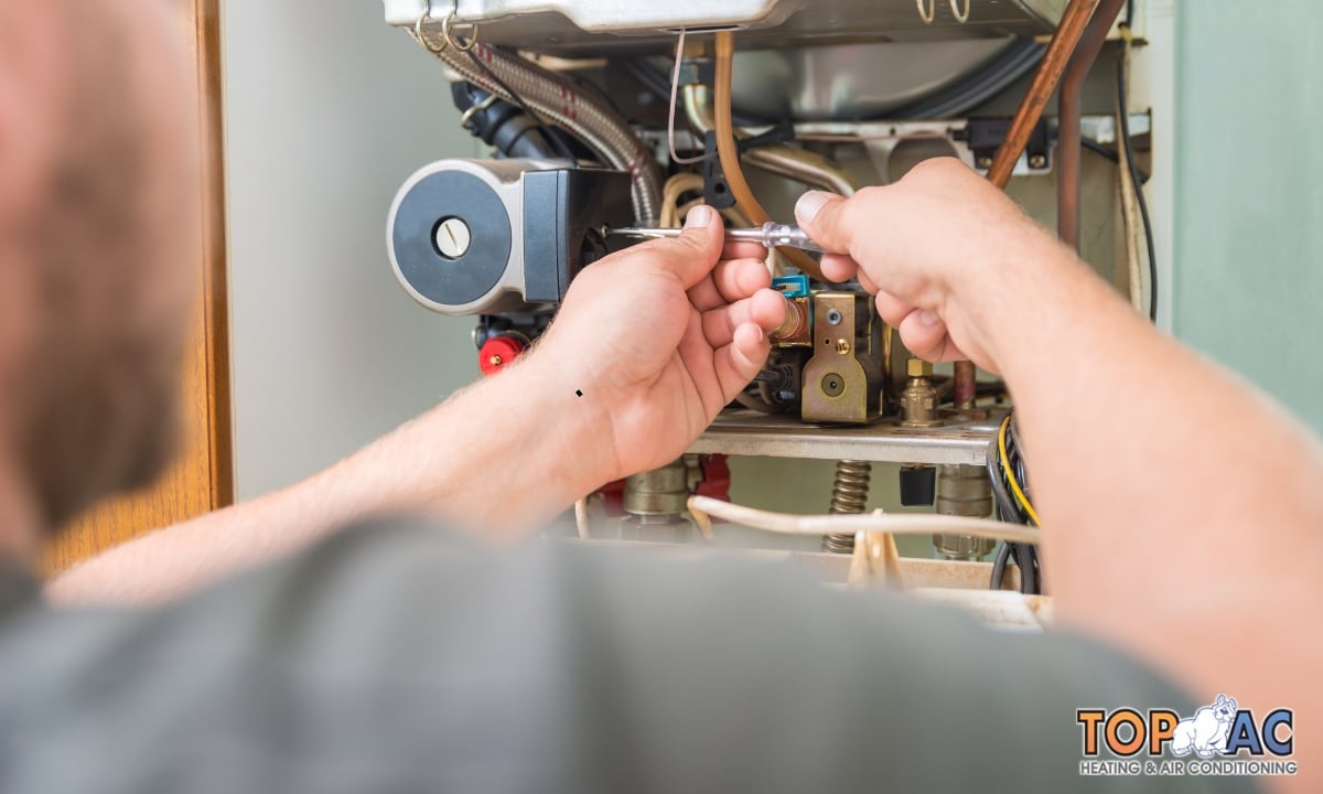 Certified furnace repair technician diagnosing heating issue in Los Angeles.