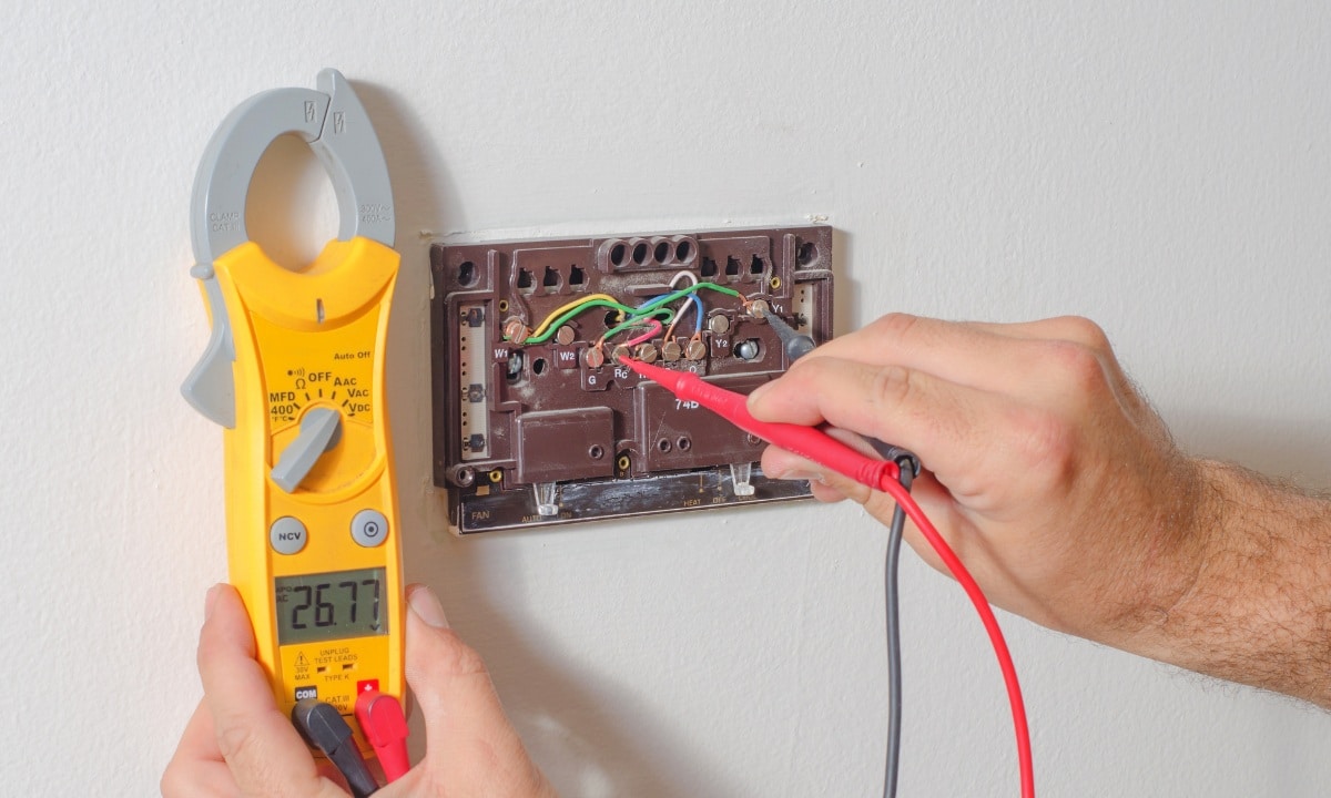 Thermostat repair in Los Angeles home, fixing temperature control.