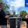 AC technician repairing a residential unit in Burbank, CA