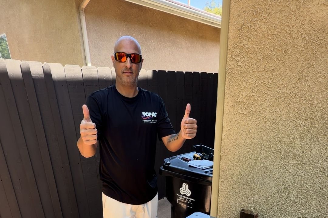 TOP AC technician installing a new air conditioning system in a Los Angeles home